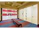 Indoor racquetball court with glass doors and marked playing area for recreational use at 1026 Via Saint Andrea Pl, Henderson, NV 89011