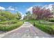 Paved walkway through the community with lush landscaping at 1026 Via Saint Andrea Pl, Henderson, NV 89011