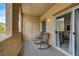 Enjoy the outdoor living space with rocking chairs and views from the balcony at 10270 Gilmore Canyon Ct # 202, Las Vegas, NV 89129