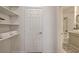 Bathroom hallway with closet storage and an adjacent bath and shower at 10270 Gilmore Canyon Ct # 202, Las Vegas, NV 89129