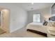 Airy bedroom with a cozy bed, large window, and easy access to the hallway at 10270 Gilmore Canyon Ct # 202, Las Vegas, NV 89129