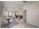 Open dining area with glass table, modern chairs, and a seamless flow to the living room at 10270 Gilmore Canyon Ct # 202, Las Vegas, NV 89129