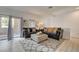 Comfortable living area with plush seating and access to outdoor balcony at 10270 Gilmore Canyon Ct # 202, Las Vegas, NV 89129