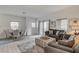 Open-concept living and dining area with modern decor and ample natural light at 10270 Gilmore Canyon Ct # 202, Las Vegas, NV 89129