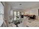 Bright living room features a glass table with modern chairs and contemporary decor at 10270 Gilmore Canyon Ct # 202, Las Vegas, NV 89129