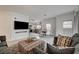 Open-concept living area connecting to a modern kitchen and dining space at 10270 Gilmore Canyon Ct # 202, Las Vegas, NV 89129