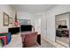 Well-lit office with contemporary desk, leather chair, and mirrored closet featuring a second office at 10270 Gilmore Canyon Ct # 202, Las Vegas, NV 89129
