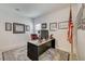 Bright office space with traditional desk, a red leather chair, and patriotic accents at 10270 Gilmore Canyon Ct # 202, Las Vegas, NV 89129