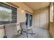 Relaxing patio featuring chairs, storage, and sliding glass doors to indoor living spaces at 10270 Gilmore Canyon Ct # 202, Las Vegas, NV 89129