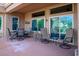 Covered back patio featuring comfortable seating and ample space for entertaining guests at 10640 Mission Lakes Ave, Las Vegas, NV 89134