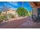 Inviting backyard with a covered patio, mature landscaping, and a gravel ground cover at 10640 Mission Lakes Ave, Las Vegas, NV 89134