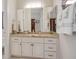 Bright bathroom featuring a custom vanity with decorative hardware and granite countertop at 10640 Mission Lakes Ave, Las Vegas, NV 89134