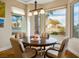 Cozy breakfast nook with large windows and views of the surrounding neighborhood at 10640 Mission Lakes Ave, Las Vegas, NV 89134