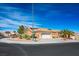 Attractive single-story home with a two-car garage and well-maintained desert landscaping under clear, blue skies at 10640 Mission Lakes Ave, Las Vegas, NV 89134