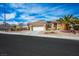 Well maintained single Gathering home features a two car garage and desert landscaping at 10640 Mission Lakes Ave, Las Vegas, NV 89134