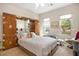 Main bedroom featuring an integrated wardrobe and views of the landscaped front yard at 10640 Mission Lakes Ave, Las Vegas, NV 89134