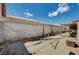 Backyard with a concrete block fence and tiled patio at 111 Narcissus Ln, Las Vegas, NV 89107