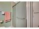 Bathroom with a sliding glass shower door, a toilet, and peach colored towels at 111 Narcissus Ln, Las Vegas, NV 89107