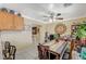 Bright dining room featuring neutral paint, tile floors and a view to the kitchen at 111 Narcissus Ln, Las Vegas, NV 89107