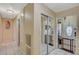 Hallway with tile flooring leading to mirrored closet doors and a white front door at 111 Narcissus Ln, Las Vegas, NV 89107