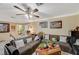 Comfortable living room featuring tiled floors, neutral walls, and a ceiling fan at 111 Narcissus Ln, Las Vegas, NV 89107