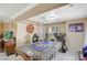 View of a living room featuring tile floors, an aquarium, and a covered pool table at 111 Narcissus Ln, Las Vegas, NV 89107