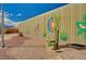 Local park with art-covered wall and benches at 111 Narcissus Ln, Las Vegas, NV 89107