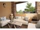 Relaxing outdoor patio with comfortable seating, stylish decor, and a serene view of the neighborhood at 11280 Granite Ridge Dr # 1101, Las Vegas, NV 89135