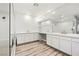 Elegant bathroom with dual vanities, sleek mirrors, a glass-enclosed shower, and modern finishes at 11280 Granite Ridge Dr # 1101, Las Vegas, NV 89135