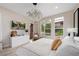 Bright bedroom featuring modern furnishings, natural light from the windows, and stylish accents at 11280 Granite Ridge Dr # 1101, Las Vegas, NV 89135