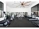 Modern gym with various exercise equipment, large windows and mirrors at 11280 Granite Ridge Dr # 1101, Las Vegas, NV 89135