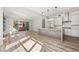 Bright, open-concept living area flows into a modern kitchen with an island and has a sliding door to a patio at 11280 Granite Ridge Dr # 1101, Las Vegas, NV 89135