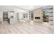 Bright living room with fireplace, floating shelves, and views from windows of the exterior landscape at 11280 Granite Ridge Dr # 1101, Las Vegas, NV 89135