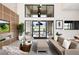 Modern lounge with large windows, stylish seating and a golf course view at 11280 Granite Ridge Dr # 1101, Las Vegas, NV 89135