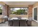 Covered outdoor dining area with a grill, a table and chairs, and views of the surrounding neighborhood at 11280 Granite Ridge Dr # 1101, Las Vegas, NV 89135