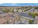 Two-story home with red tile roof and solar panels near a cross street in neighborhood at 1131 Orange Meadow St, Las Vegas, NV 89142