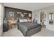 Bedroom with bed, gray walls and view into on-suite bathroom at 1131 Orange Meadow St, Las Vegas, NV 89142