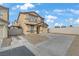 Two-story home with a beige exterior, a concrete driveway, and a one car garage at 1131 Orange Meadow St, Las Vegas, NV 89142