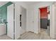 Hallway with three doors leading to bedrooms and bathrooms at 1131 Orange Meadow St, Las Vegas, NV 89142
