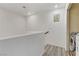 Bright second floor hallway with wood floors, access to laundry room, and a contemporary design at 1131 Orange Meadow St, Las Vegas, NV 89142