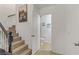 Hallway showing stairs to the upper level and entry to the half bathroom at 1131 Orange Meadow St, Las Vegas, NV 89142