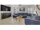 Bright living room with comfortable seating, plantation shutters, and a large television at 1131 Orange Meadow St, Las Vegas, NV 89142