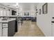 Open-concept living space with seamless transition from kitchen, bar seating, and comfortable lounge at 1131 Orange Meadow St, Las Vegas, NV 89142