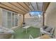 Enclosed patio featuring comfortable seating and artificial turf flooring at 1131 Orange Meadow St, Las Vegas, NV 89142