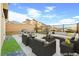 Stylishly staged patio with a comfortable seating area, mountain views, and dining set, ideal for outdoor entertaining at 11676 Midnight Melody Ave, Las Vegas, NV 89138