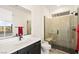Modern bathroom featuring a glass shower with seat, quartz countertops, and contemporary fixtures at 11676 Midnight Melody Ave, Las Vegas, NV 89138