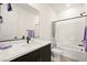 Bathroom with a modern vanity, a large mirror, and a shower-tub combination at 11676 Midnight Melody Ave, Las Vegas, NV 89138