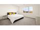 Bedroom featuring a large window, plush carpet, and a comfy bed at 11676 Midnight Melody Ave, Las Vegas, NV 89138