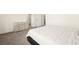 Spacious bedroom showcasing plush carpet, neutral decor, and a large window at 11676 Midnight Melody Ave, Las Vegas, NV 89138