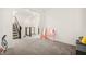 Spacious bonus room with plush carpet, pink vanity, and easy access to staircase at 11676 Midnight Melody Ave, Las Vegas, NV 89138